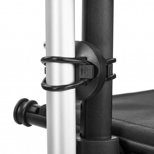 Close-up of a black metal clip attached to a white pole on a chair.