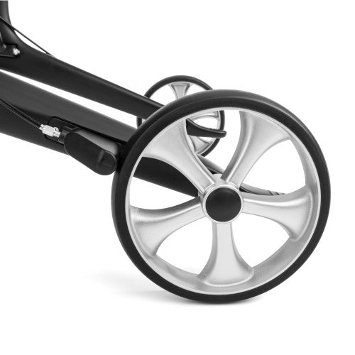 Close-up of a black stroller wheel with silver rim on a white background