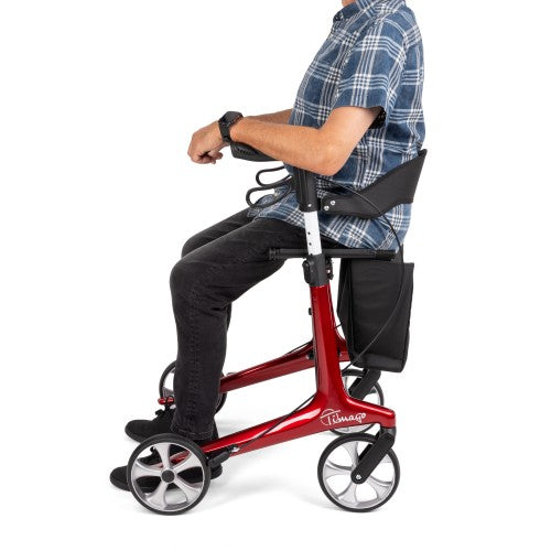 Person using a red knee walker on a white background